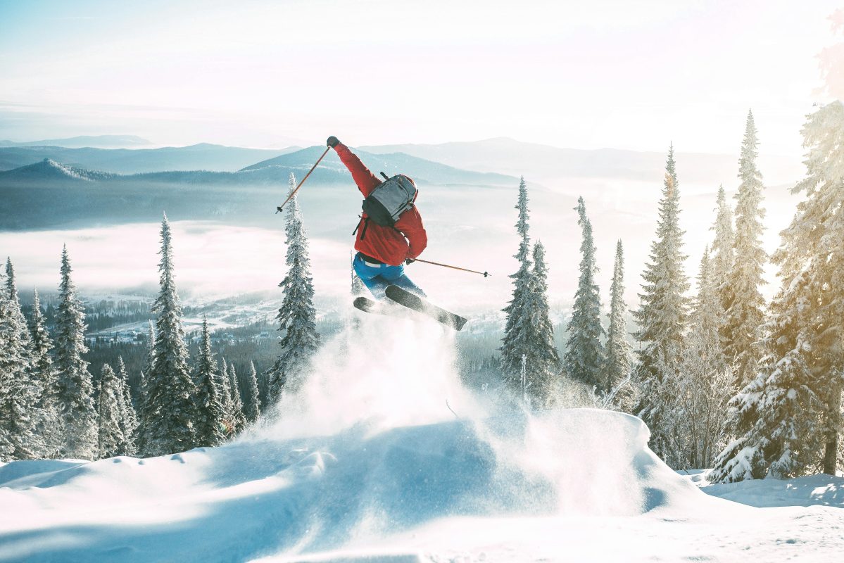 A snowboard engineer examining a damaged snowboard edge to analyze core fatigue and prevent delamination